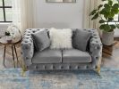 Two-seater grey velvet sofa